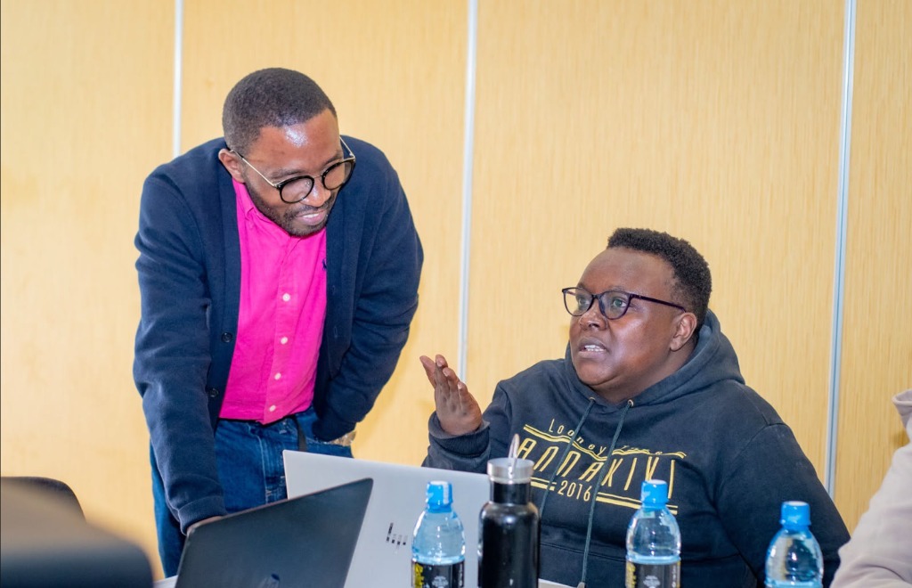 Ndovesha team member guiding a participant through the platform